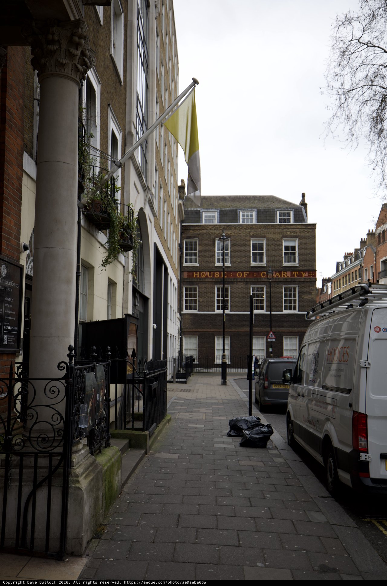 Narrow London Alley Leading to Historic House of Charity