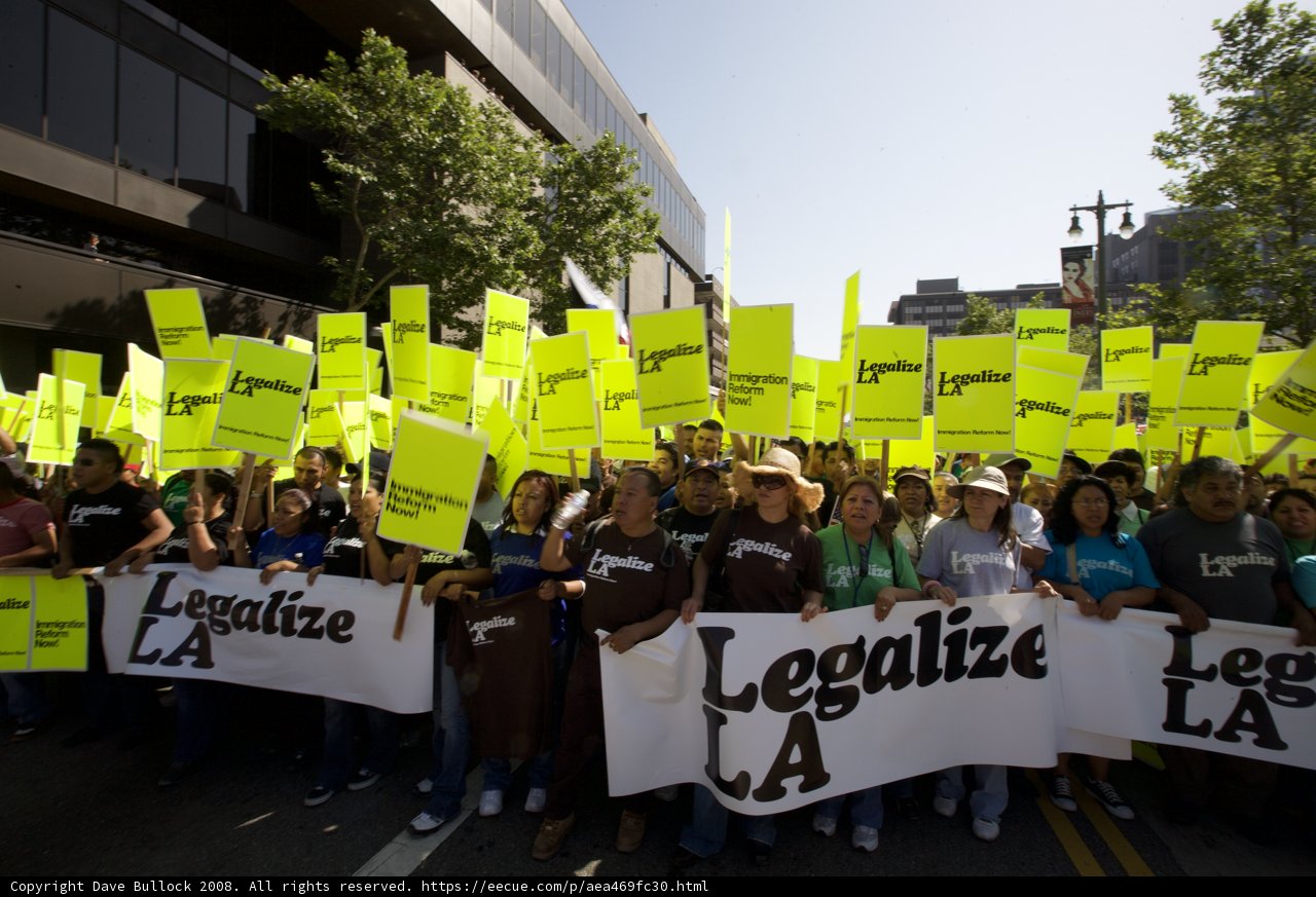 Mayday Rally Protesters Hold Up Messages on Signs