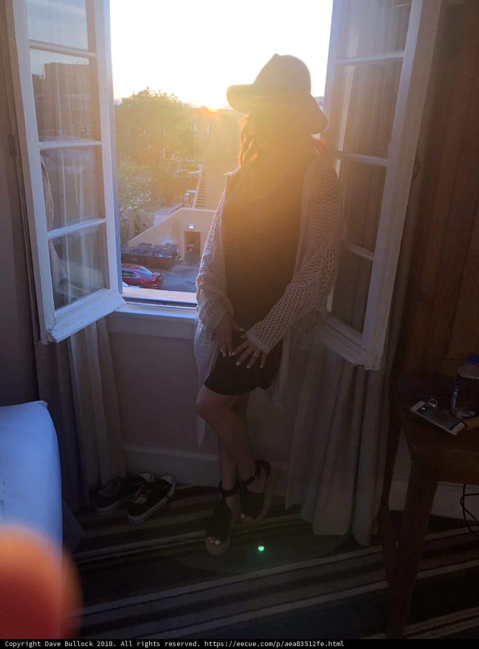 Window Gazing in a Chic Hat