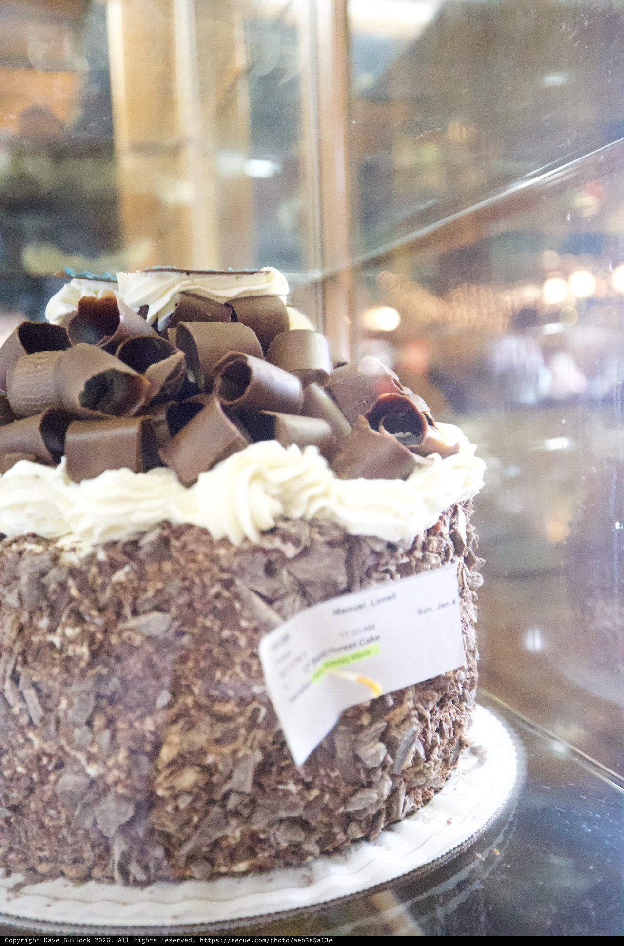 Decadent Chocolate Cake Display in Bakery Window