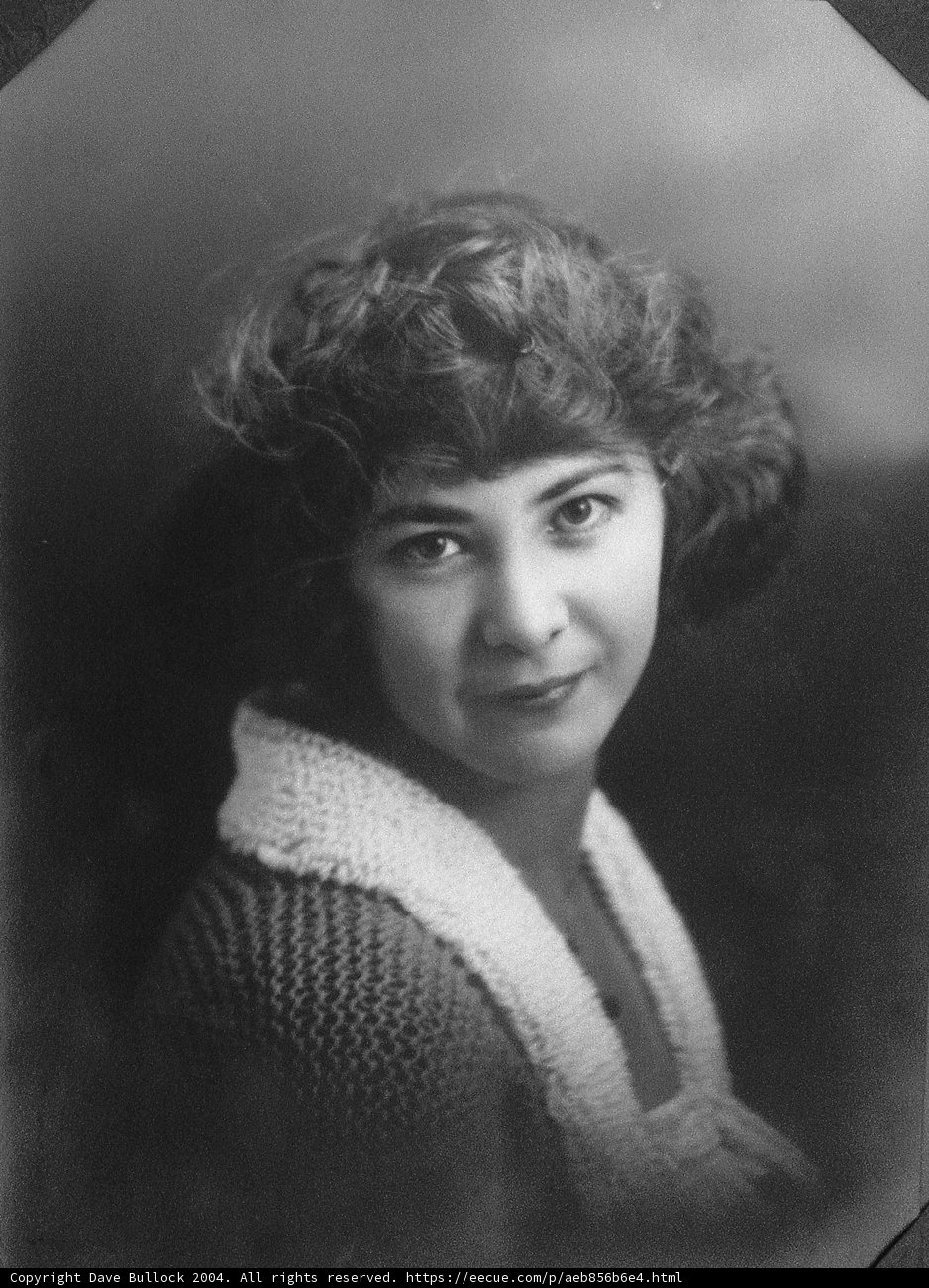 Vintage Portrait of a Happy Woman with Curly Hair