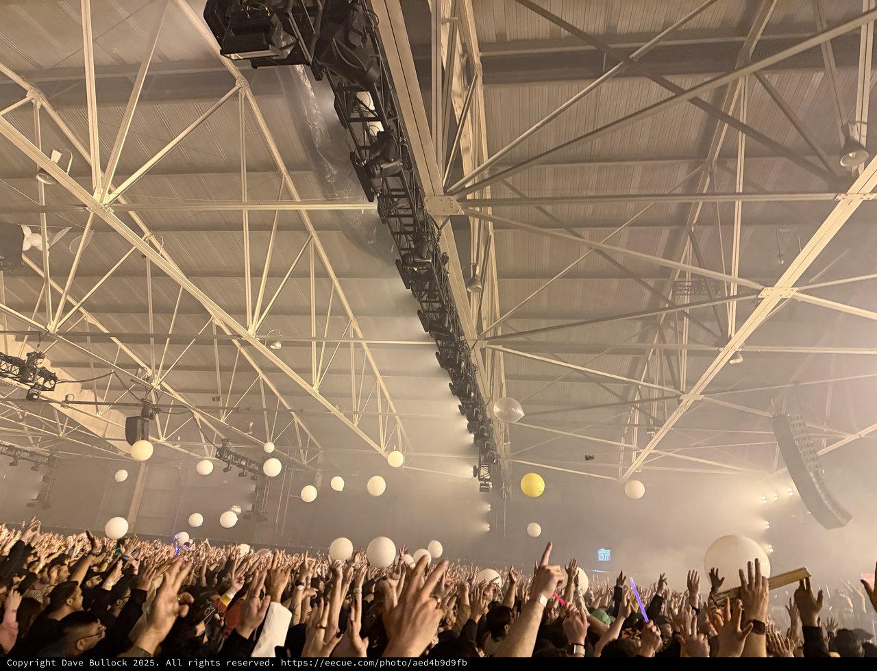 Skrillex and Four Tet Concert Crowd in Industrial Venue