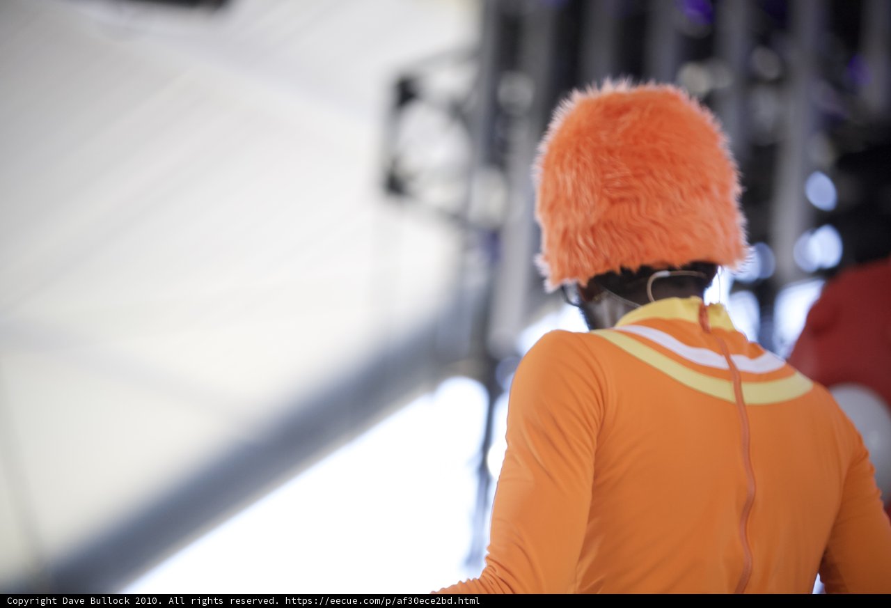 Man in Orange Hat and Black Shirt