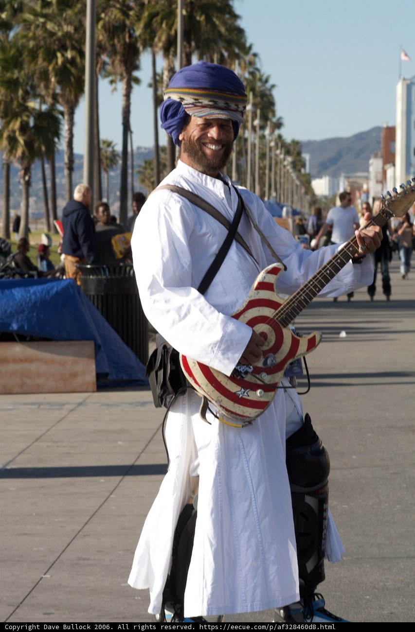 Turbaned Musician Playing Electric Guitar Outdoors