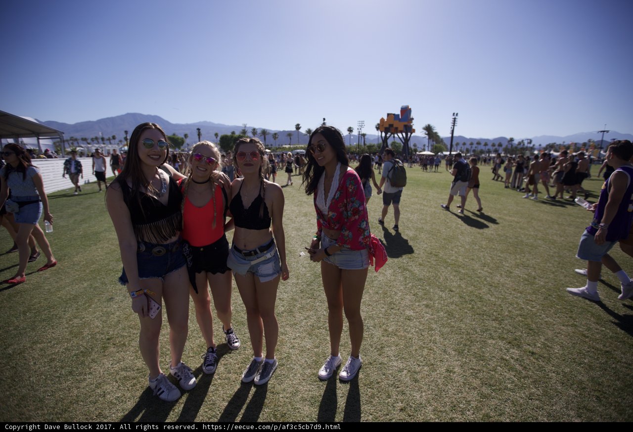 Three Girls at Coachella Caption: Madeline Weinstein and her friends take a break from the music and festivities to capture a moment in front of the beautiful blue sky and rolling hills at Coachella.