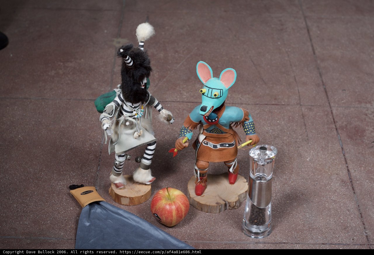 Two Figurines Enjoying an Apple Treat
