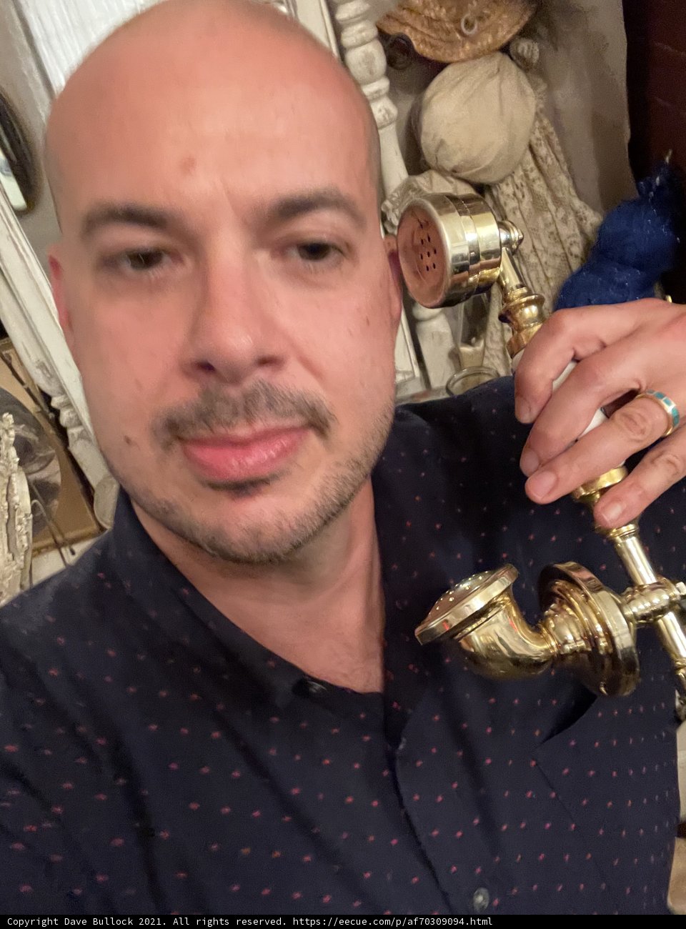 Dave B Holding a Brass Shower Head