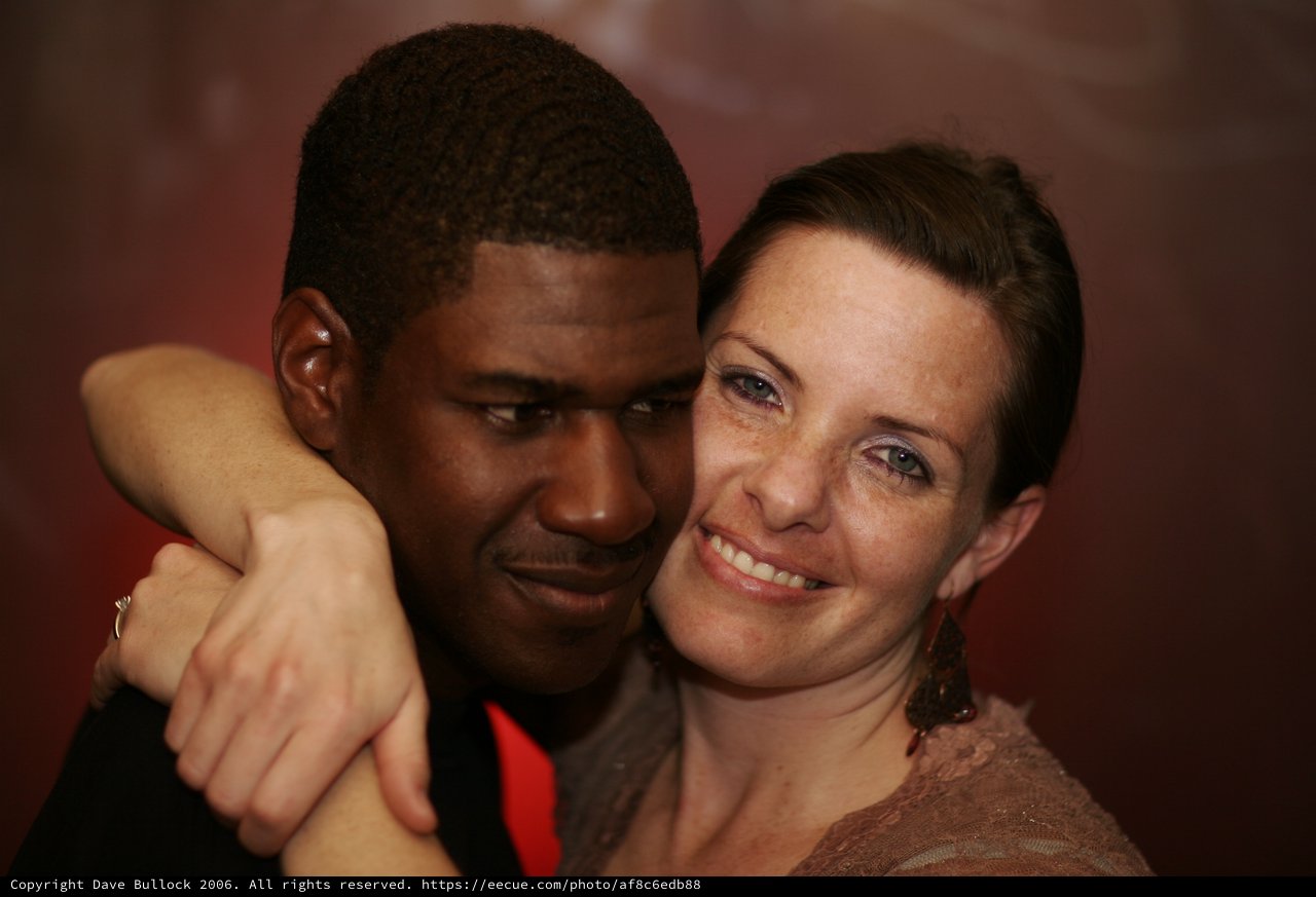 Intimate Embrace Between Two People at Evening Event