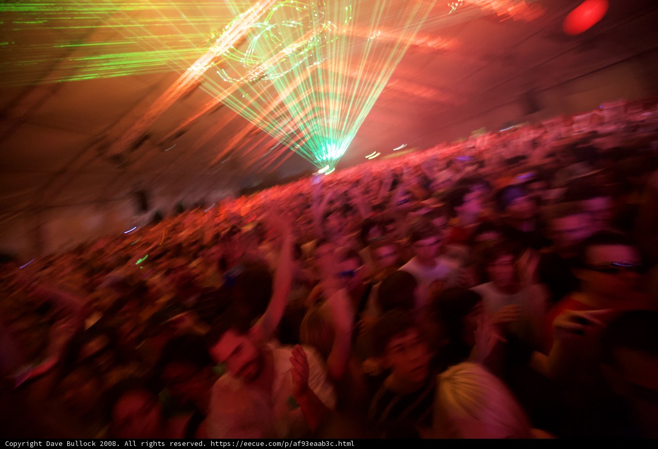 Green Spotlight on the Nightclub Crowd