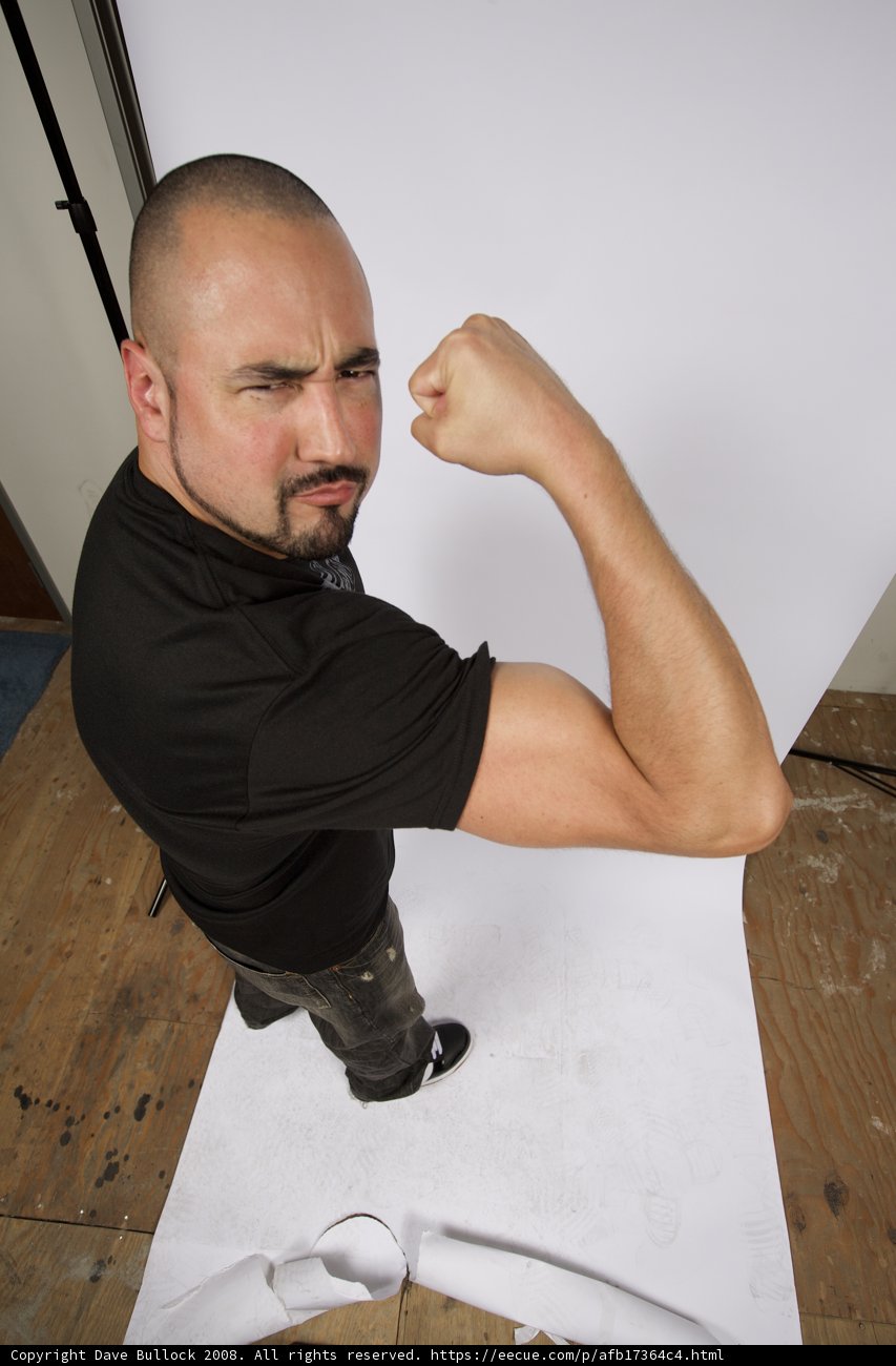 Black Shirted Man on Plywood Floor