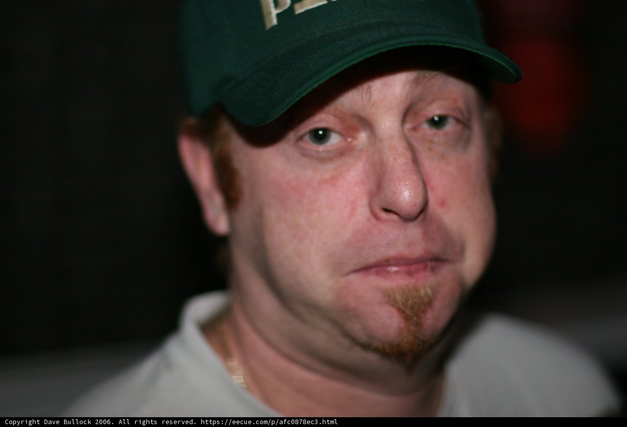 Man in Green Baseball Cap