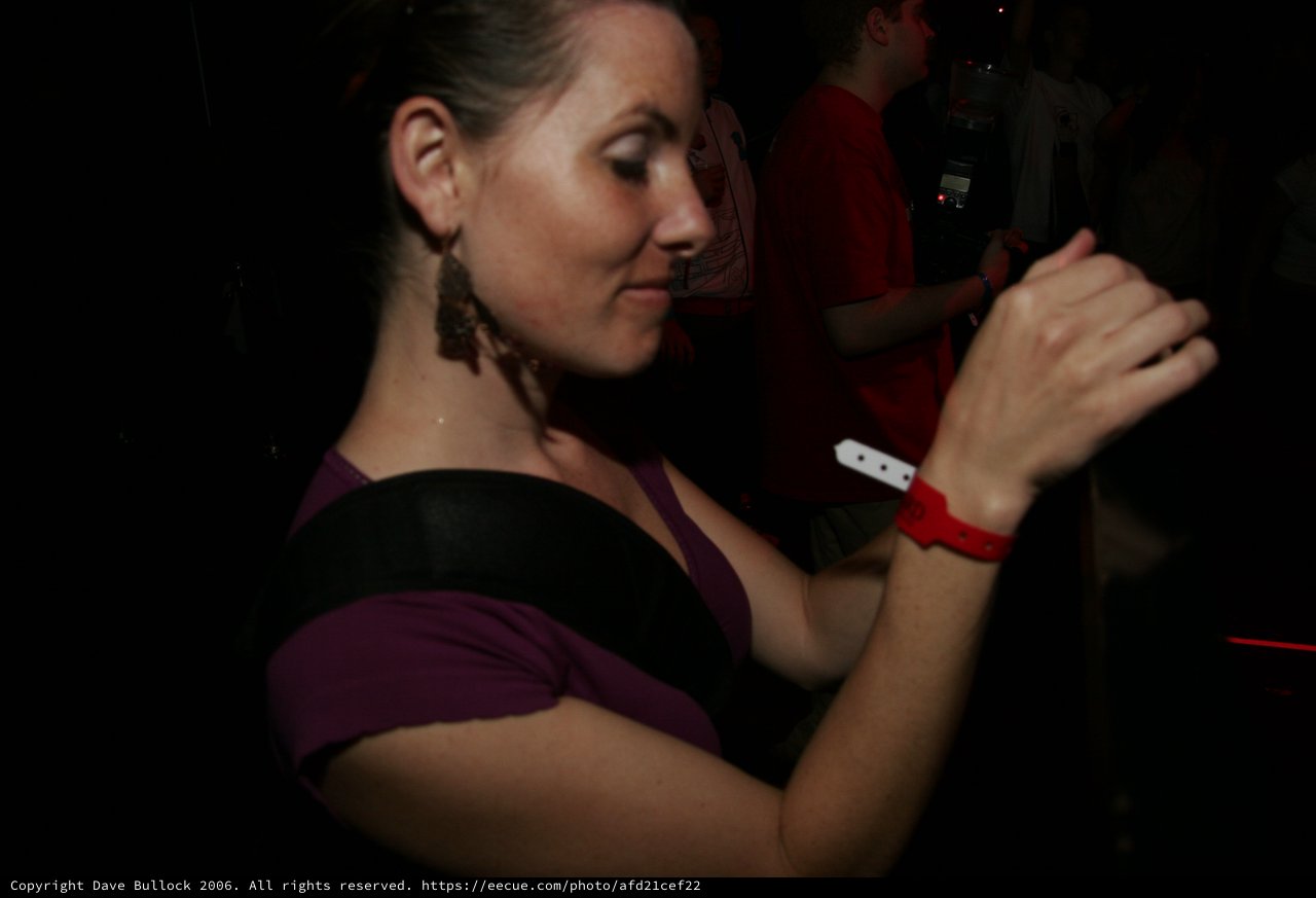 Woman Dancing Intimately at Late Night Club Event