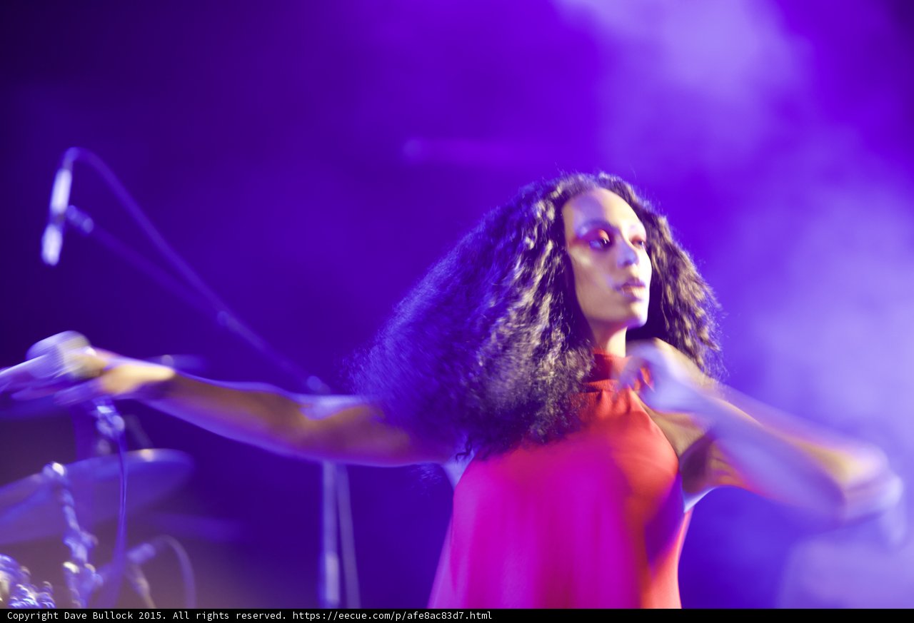 Solange Arms Spread Wide Facing Camera Motion Blur Purple