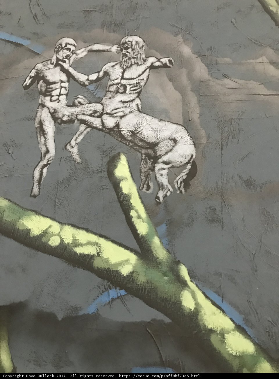 Two Men Fighting on a Tree Branch
