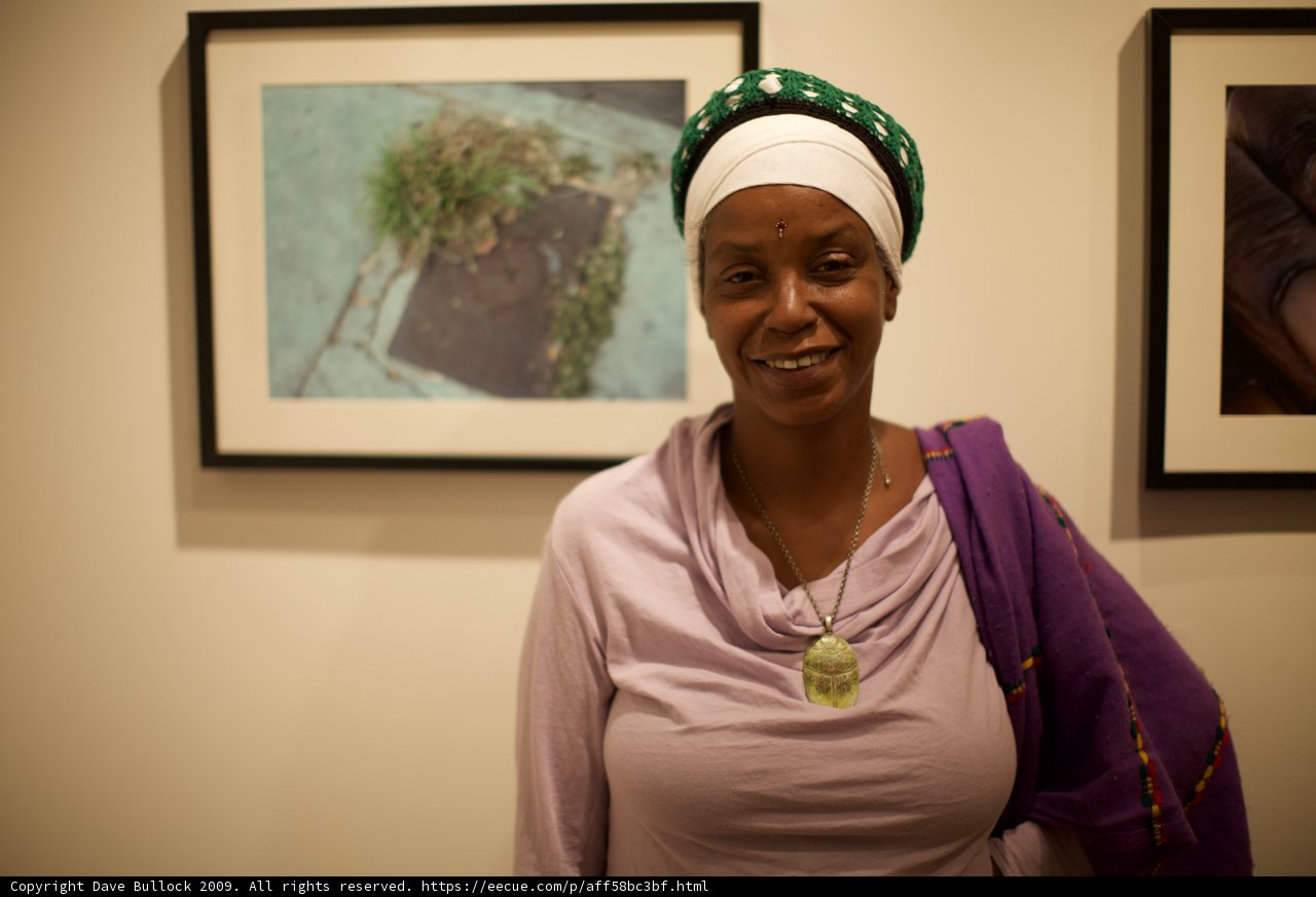 Smiling Woman in Turban Surrounded by Art