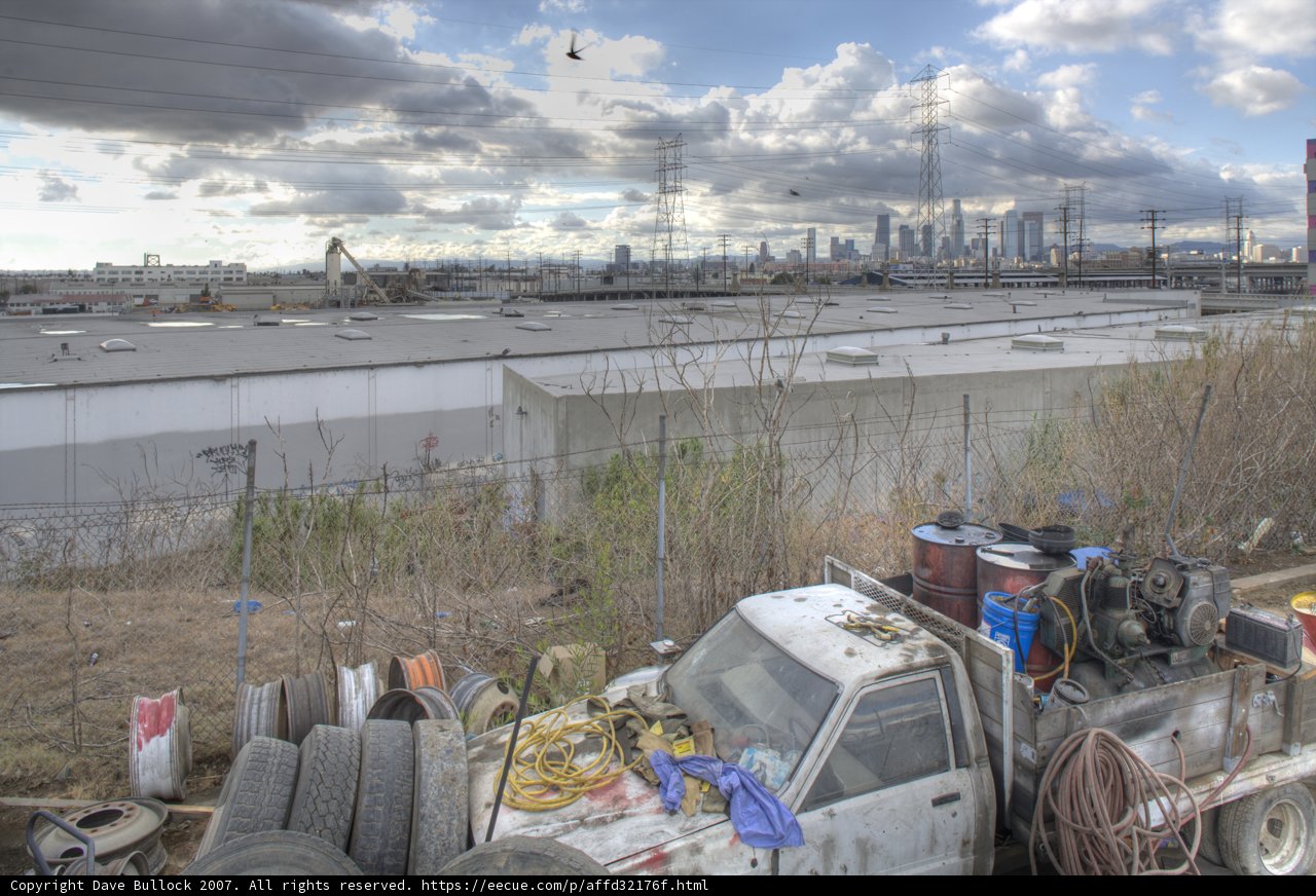 Cityscape and Truck in the Field
