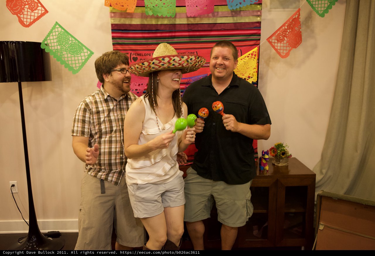 Friends Celebrate with Sombrero and Maracas at Fiesta
