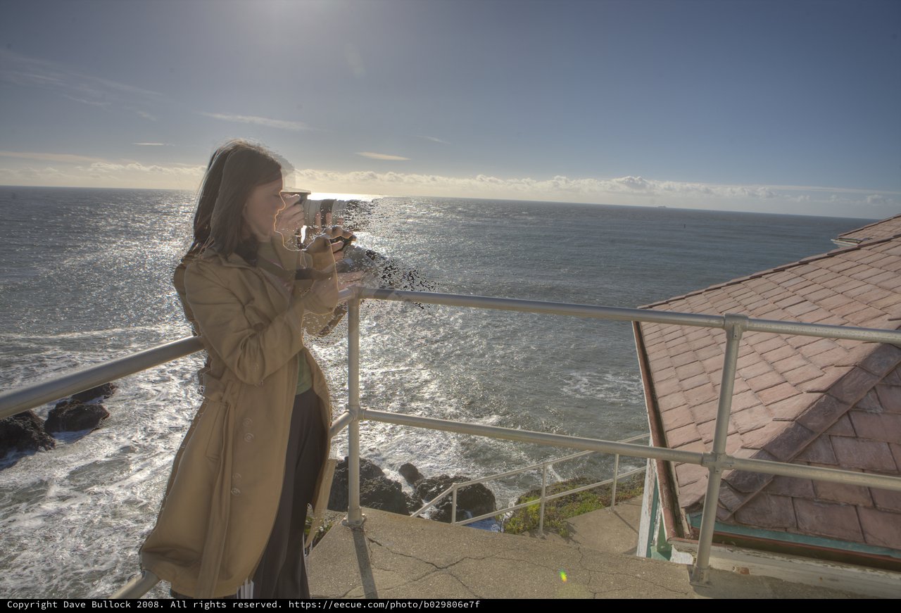 Photographer Capturing the Pacific Coast from Lighthouse Overlook
