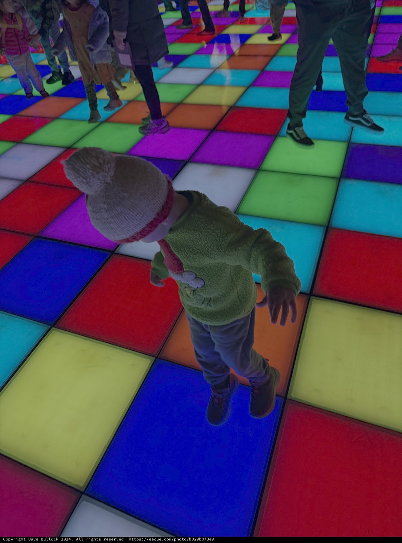 Child Playing on Interactive LED Dance Floor