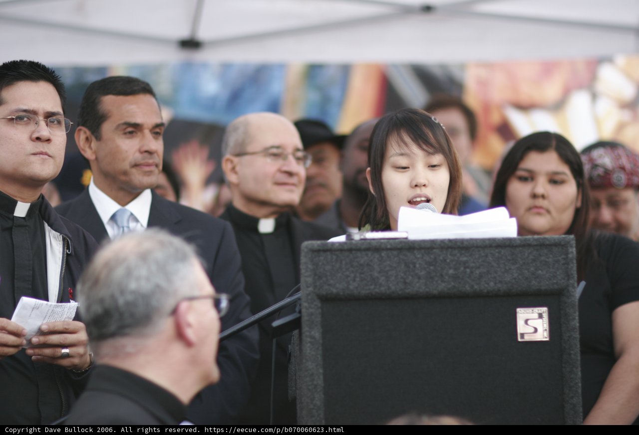 Woman delivering speech at podium
