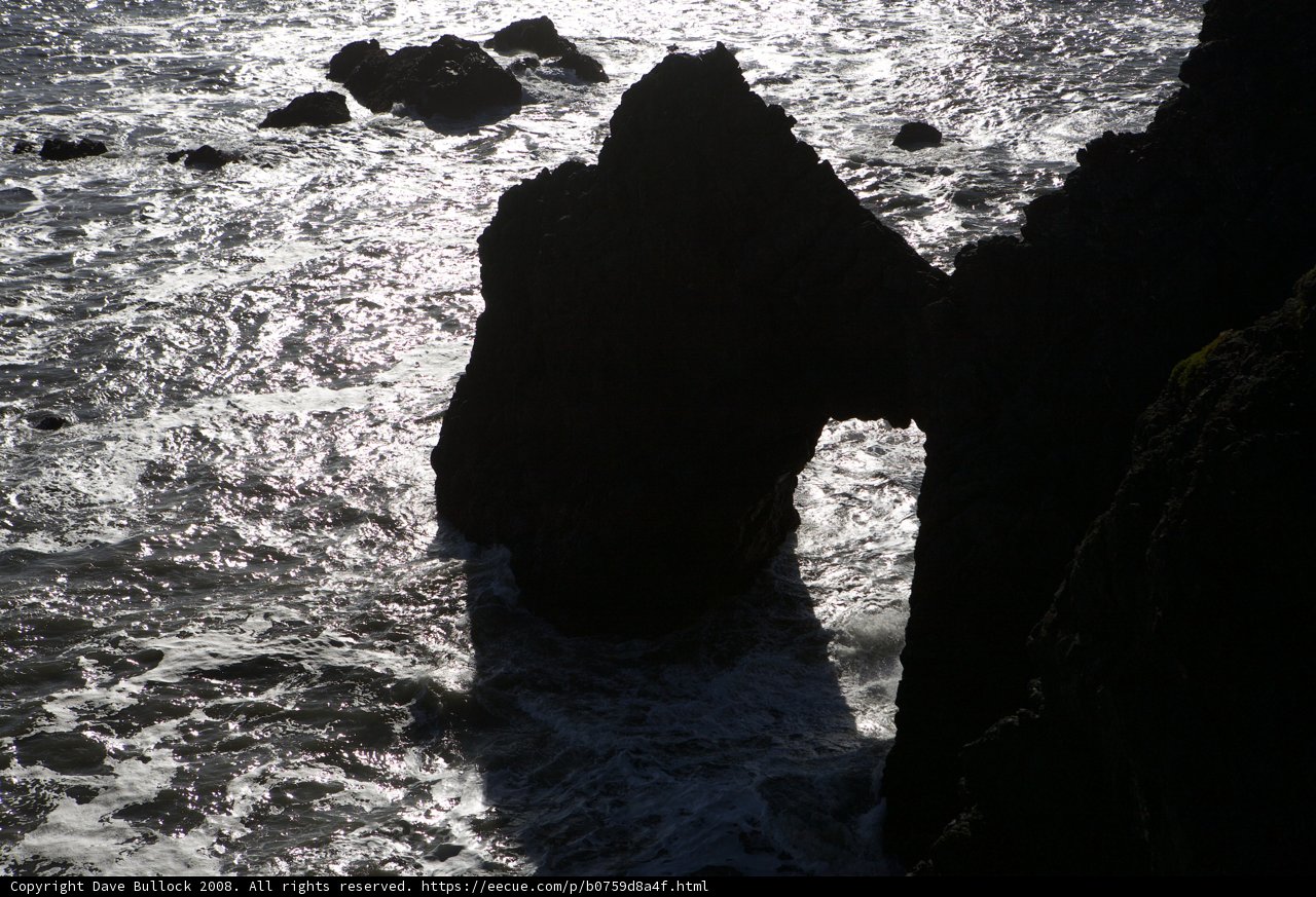Sunlit Rock Formation in the Ocean