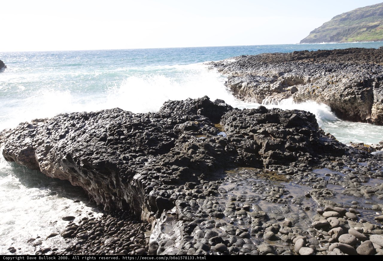 A Majestic Outcrop by the Rushing Sea