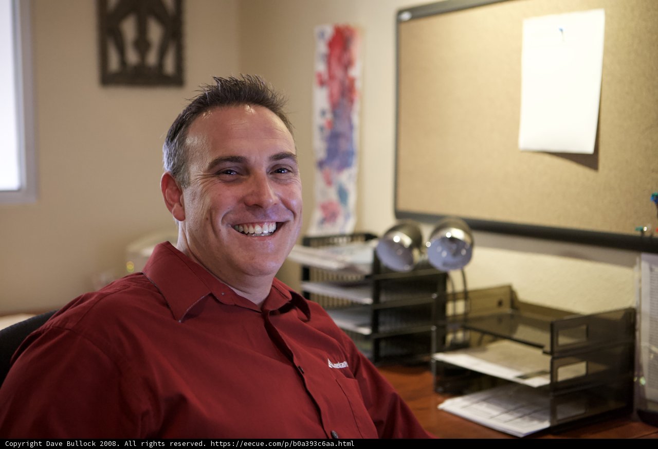Smiling Man at his Plywood Desk