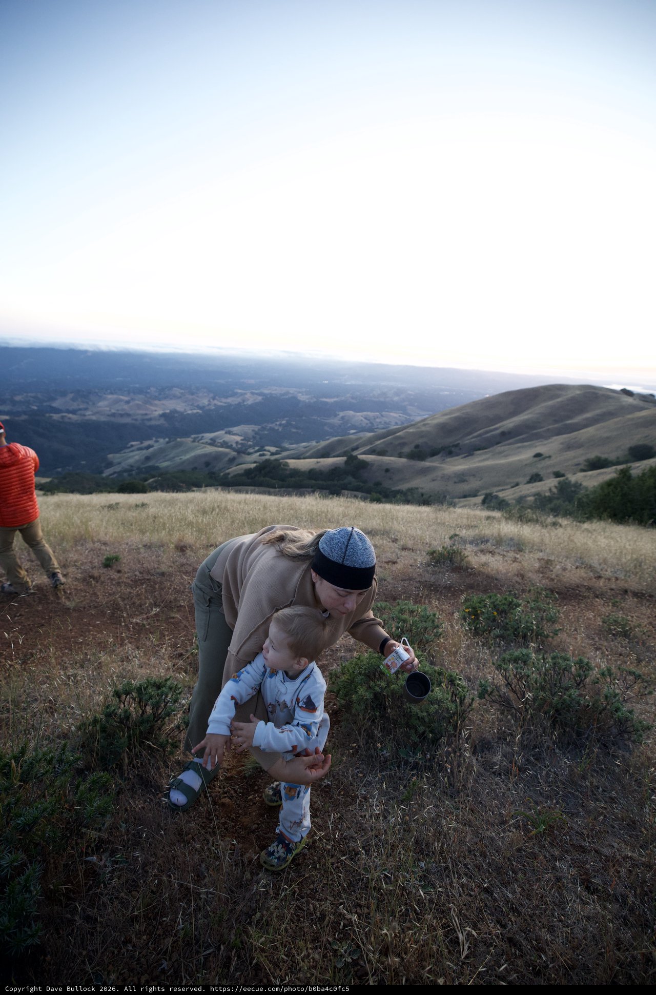 Mother and Toddler Explore Hilltop at Golden Hour