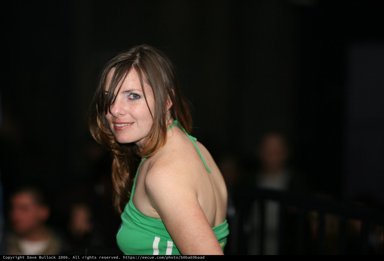 Penelope Smiles Over Shoulder in Green Halter
