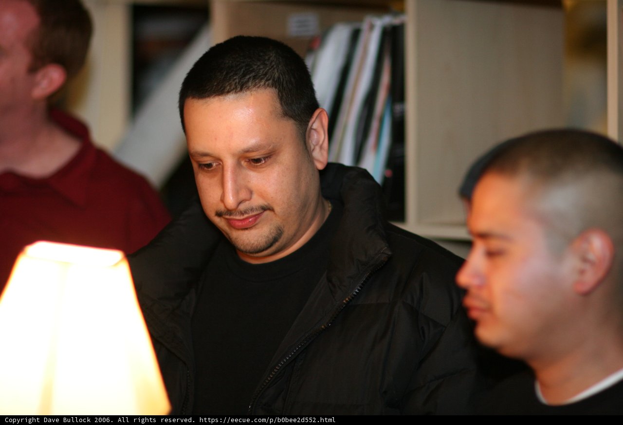 Man Contemplating Lampshade