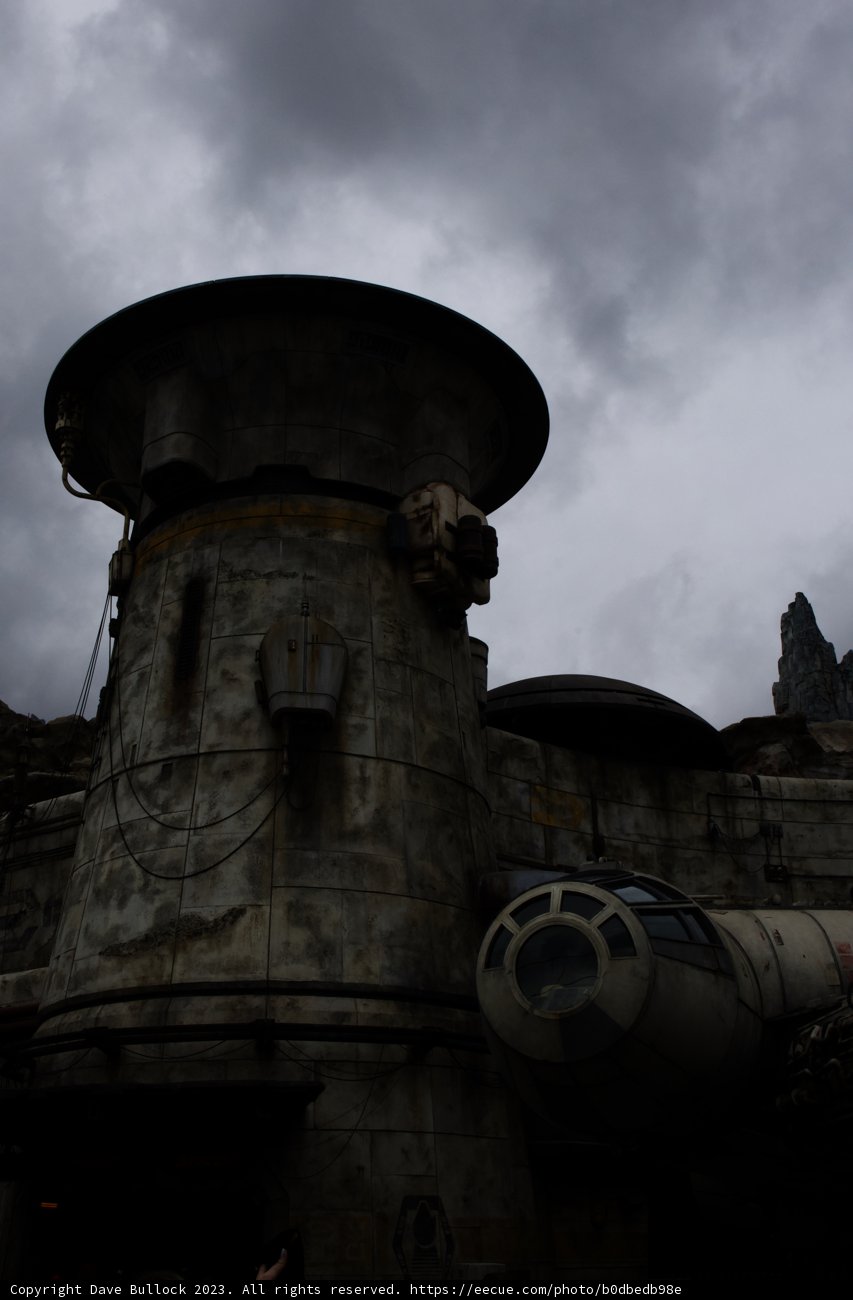 Millennium Falcon Soars Above Towering Architecture
