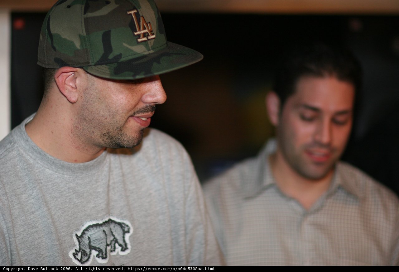 Clutch Man in Grey Shirt