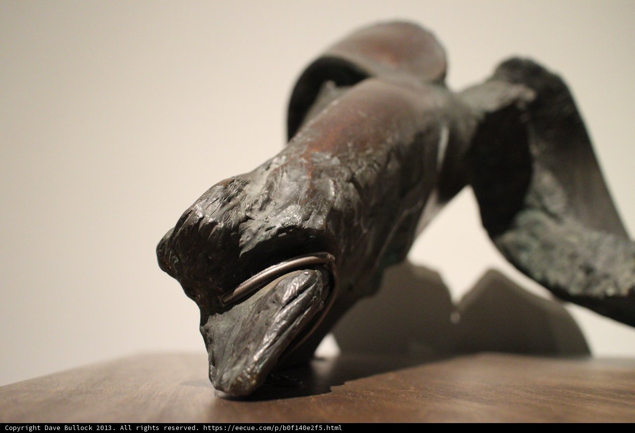 Bronze Bird Sculpture on a Wooden Table