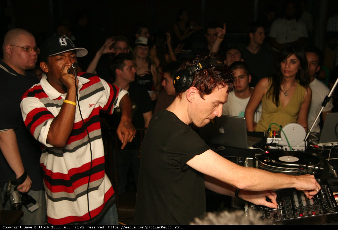 Nightclub DJ in Black Shirt with Hat and Headphones