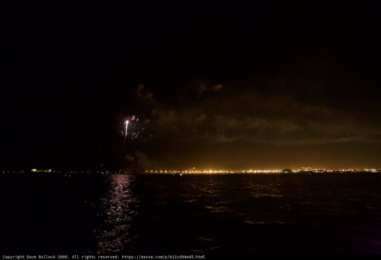 City Lights and Spectacular Fireworks over the Water