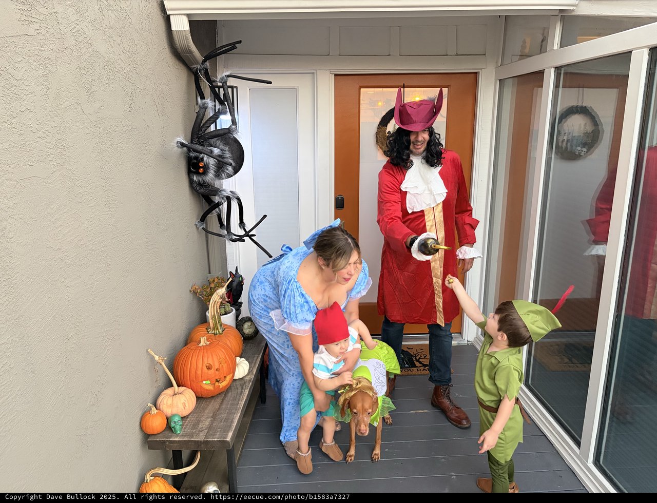 Family Halloween Trick-or-Treating at the Front Door