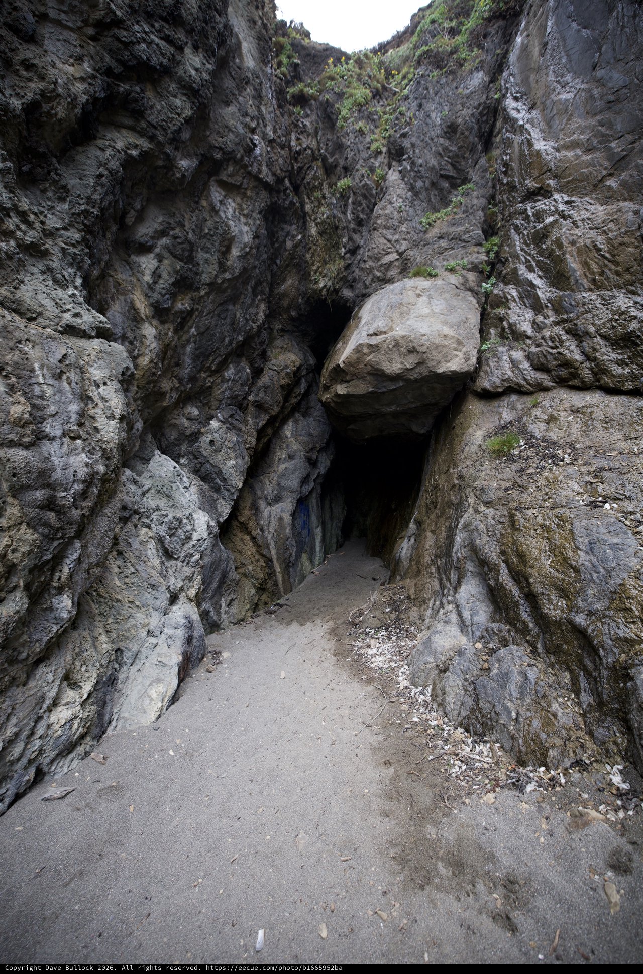 Dark Passage Through Ancient Sea Cave Entrance