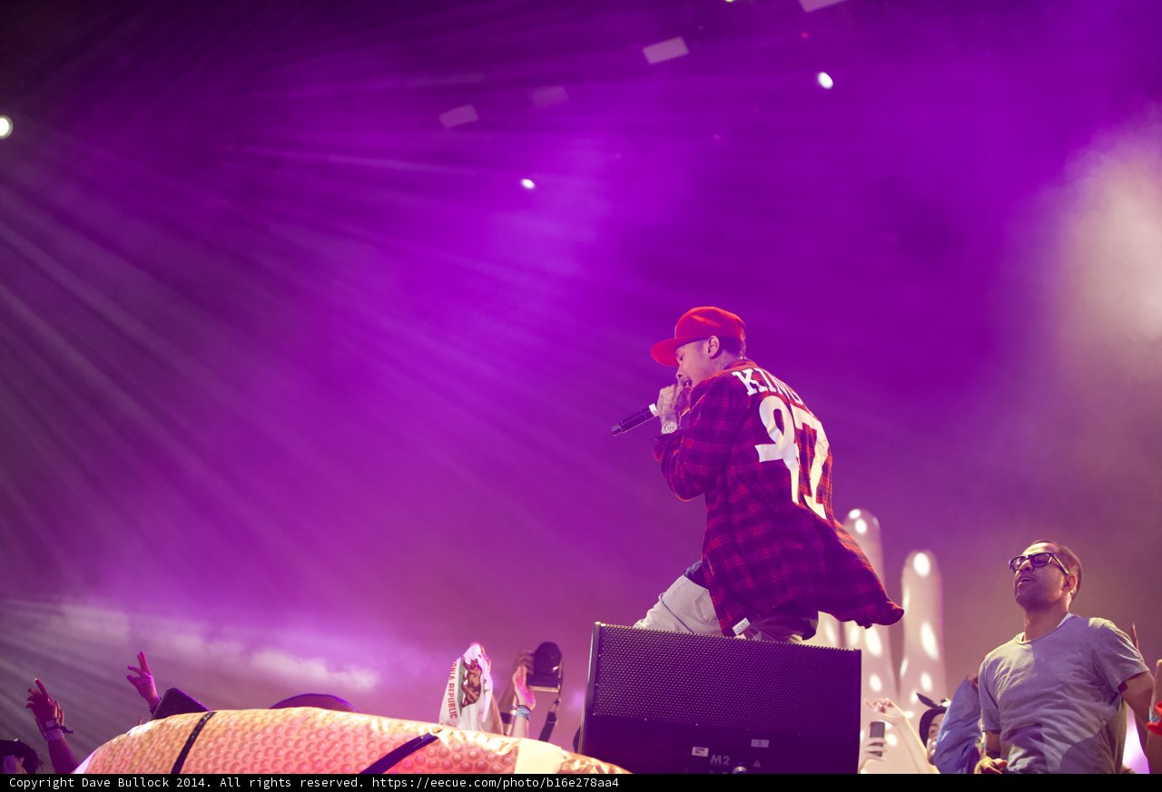 Tyga Rocks Coachella Stage in Plaid and Red Cap