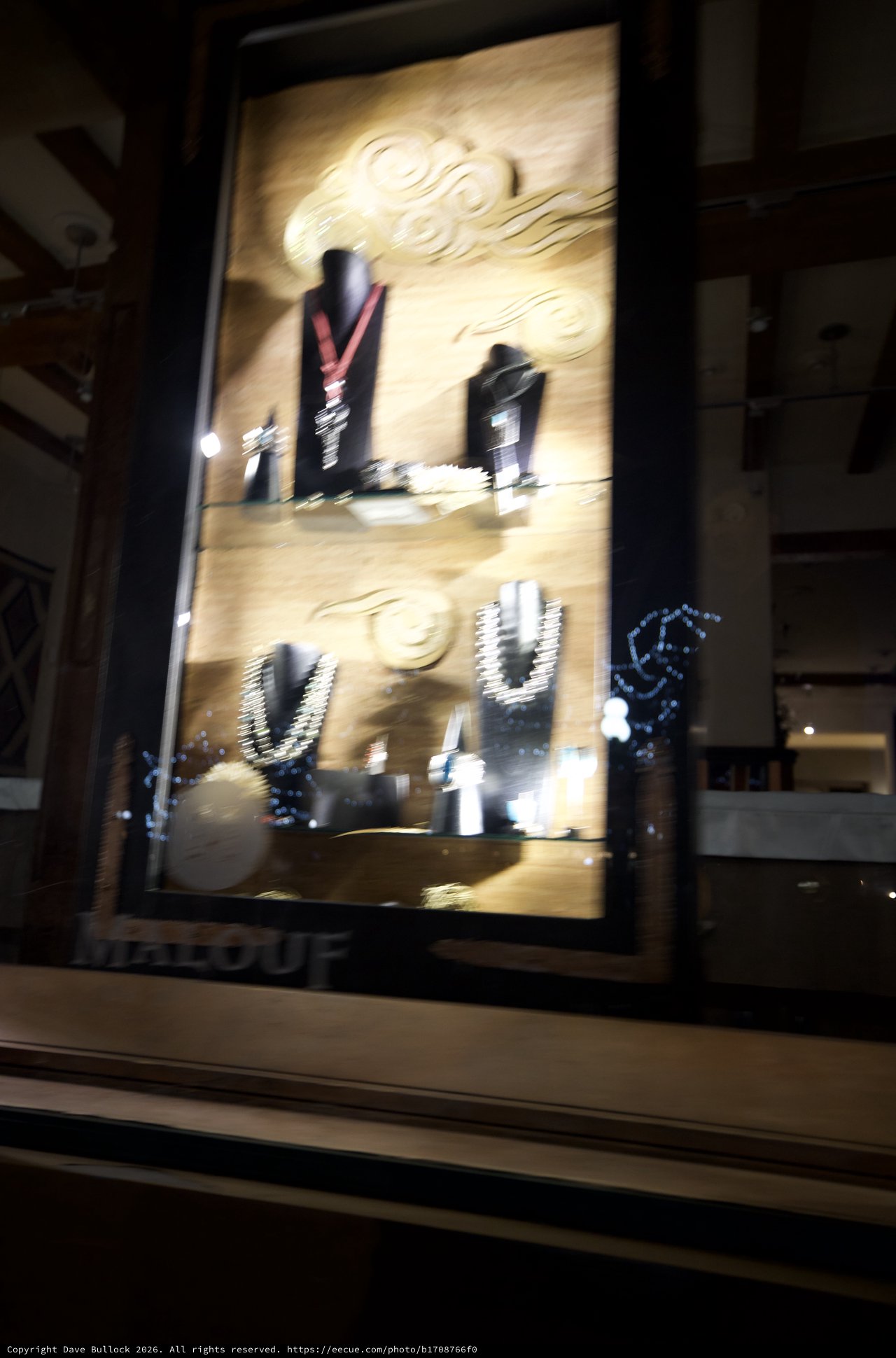 Illuminated Jewelry Display Case at Night
