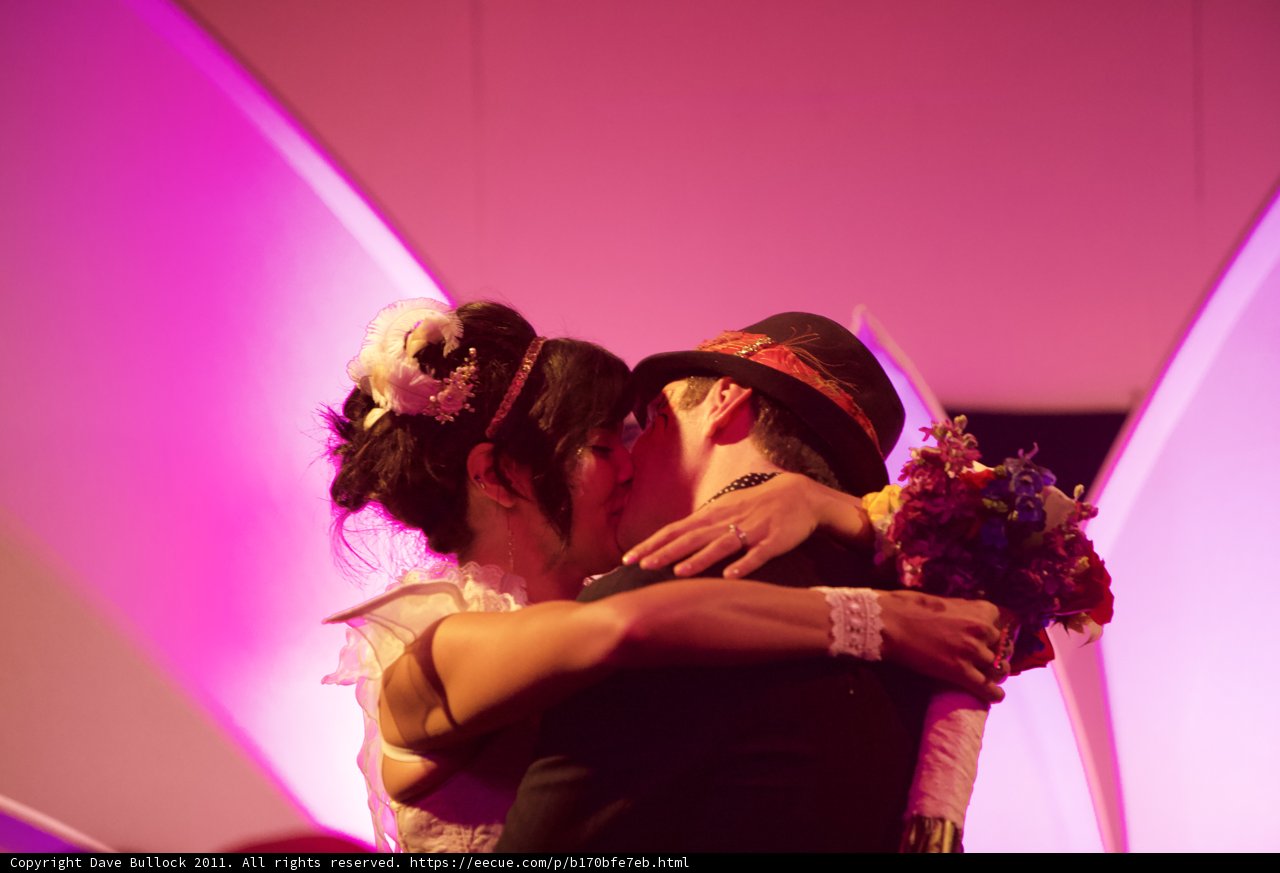 A Romantic Kiss under Pink Light