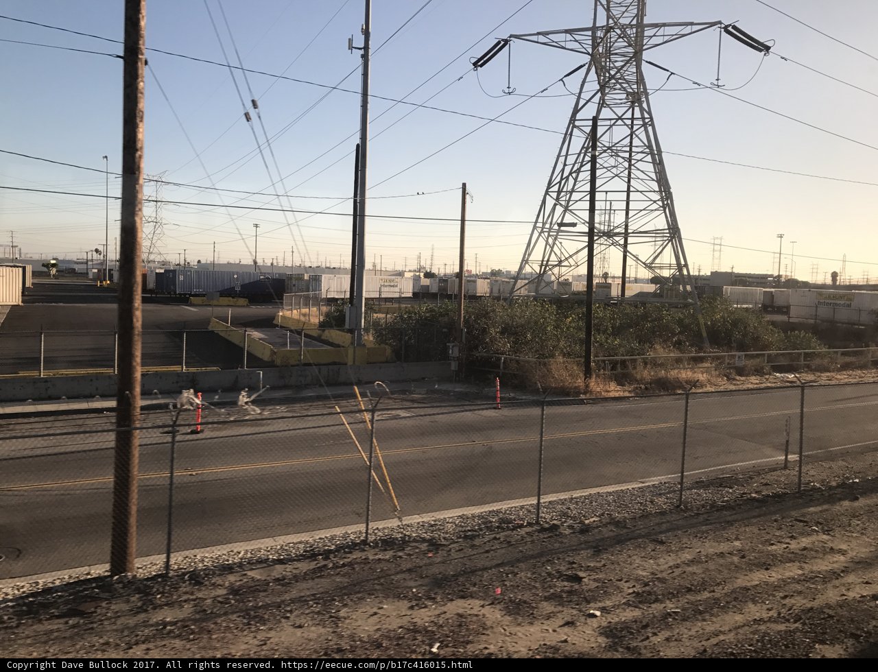 Towering Power Lines and Fence