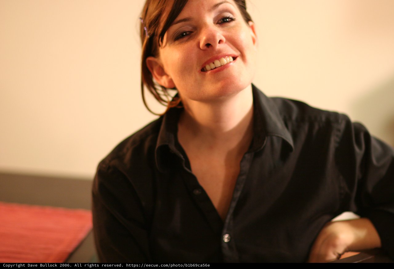 Candid Portrait of Smiling Woman in Black Shirt