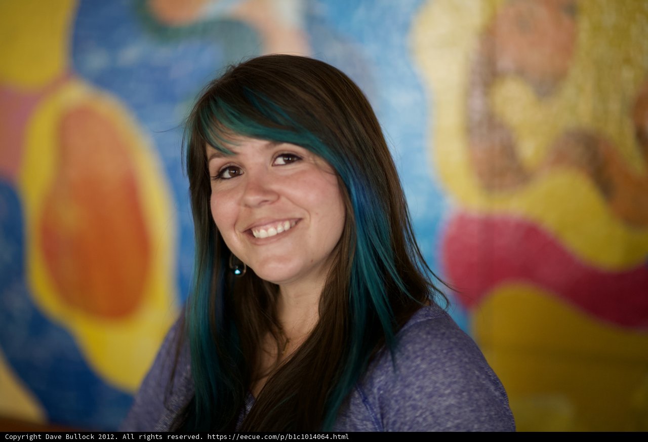 Blue-haired Woman's Joyful Smile