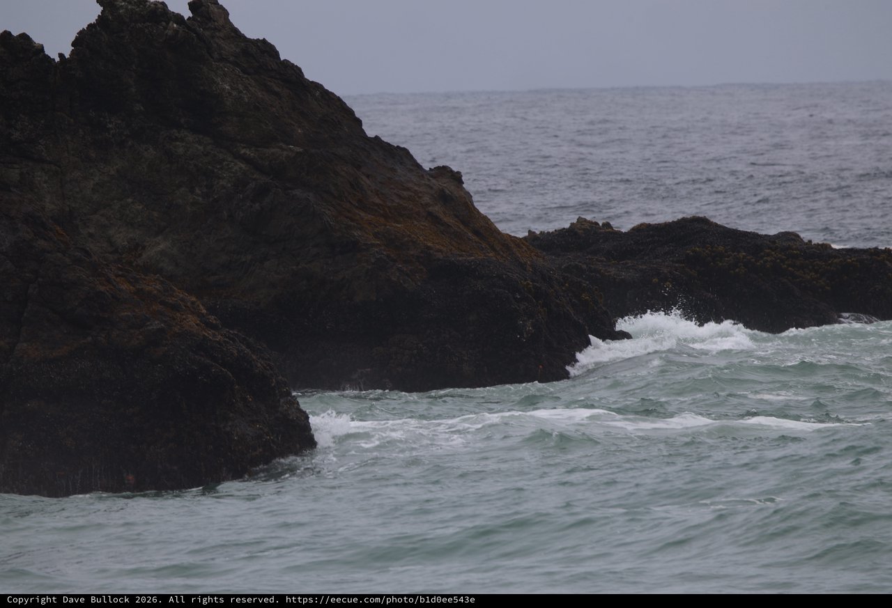 Dark Coastal Rocks Battered by Atlantic Swells