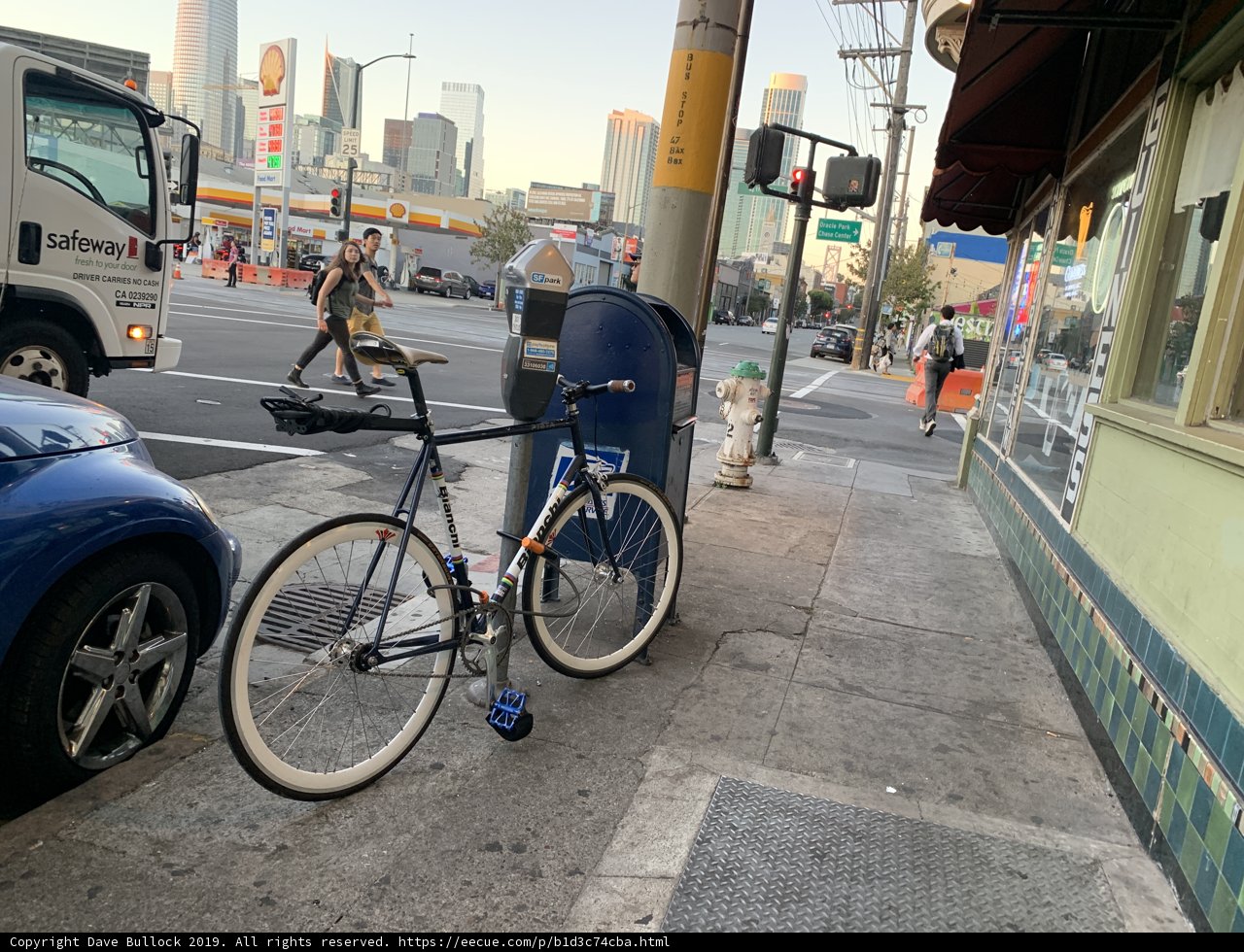 Parked Bicycle on a Busy San Francisco Sidewalk