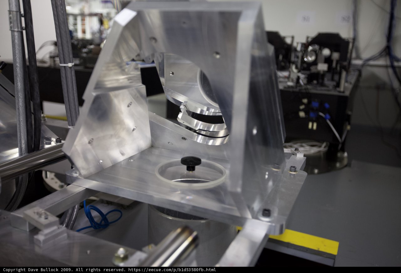 Machine being worked on in a busy factory