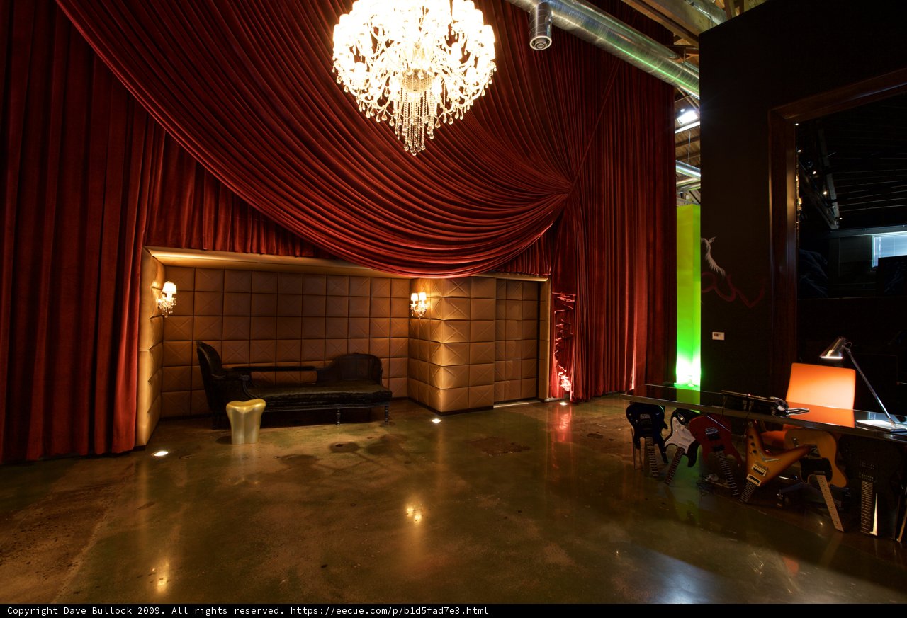 The Red Curtains and Glowing Chandelier