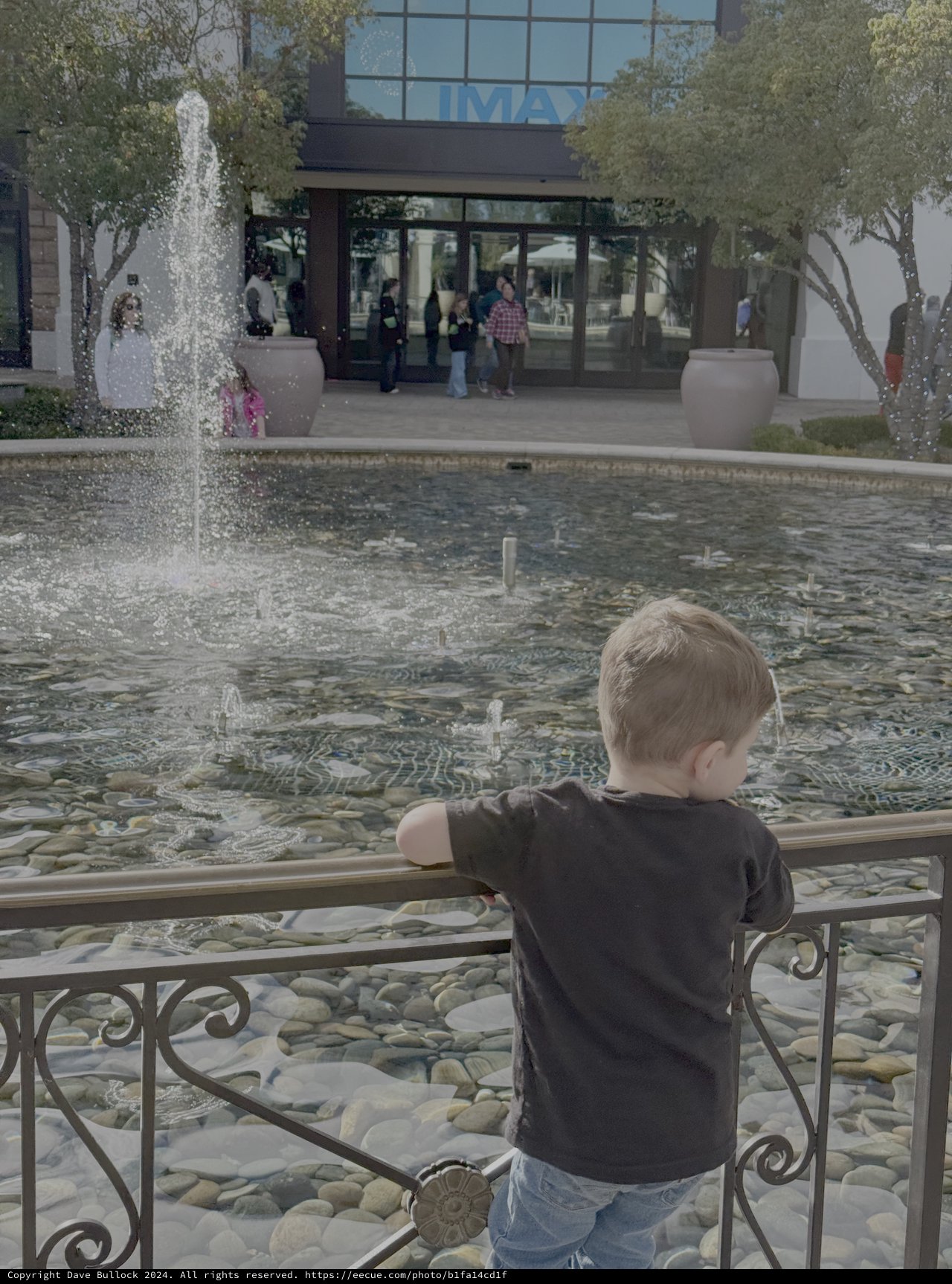 Child Watching Fountain at Urban Museum Plaza
