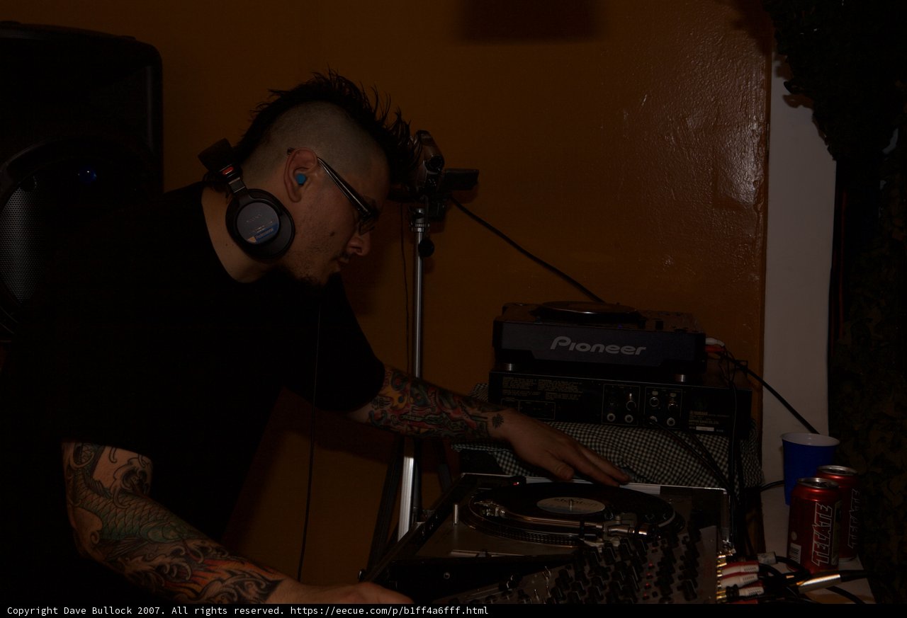 Tattooed Deejay Mixing Dubstep Music