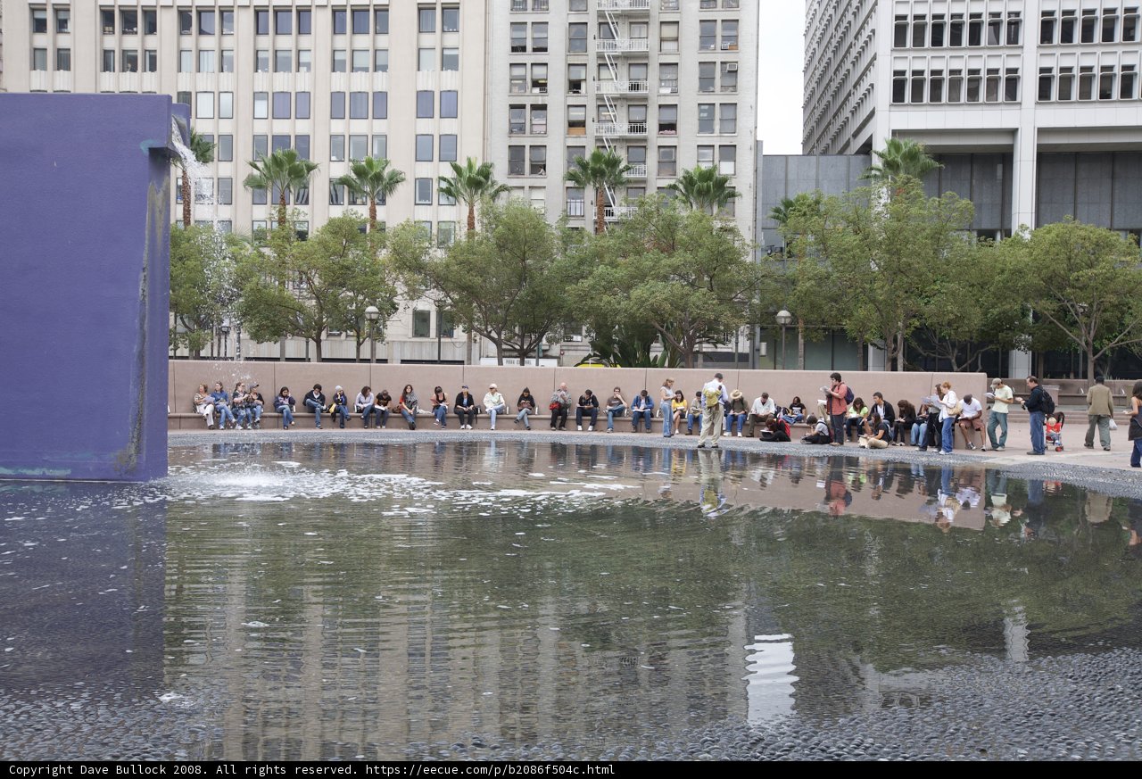 City dwellers gather around a beautiful fountain
